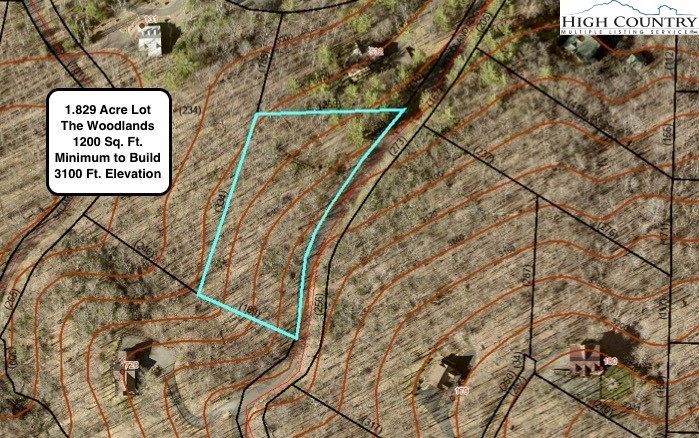 a sign on a wall next to a road