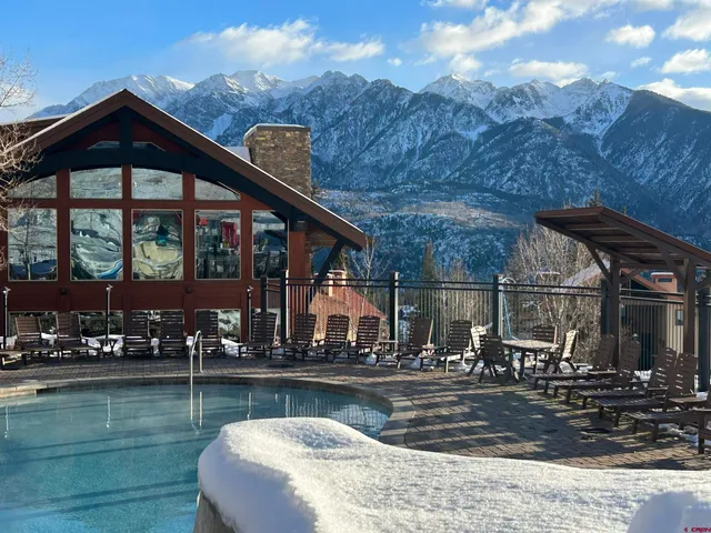 a front view of a house with swimming pool