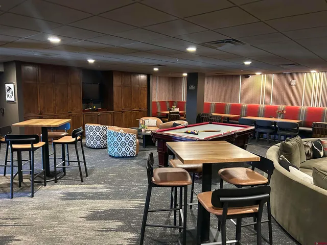 a outdoor dining space with furniture and kitchen view