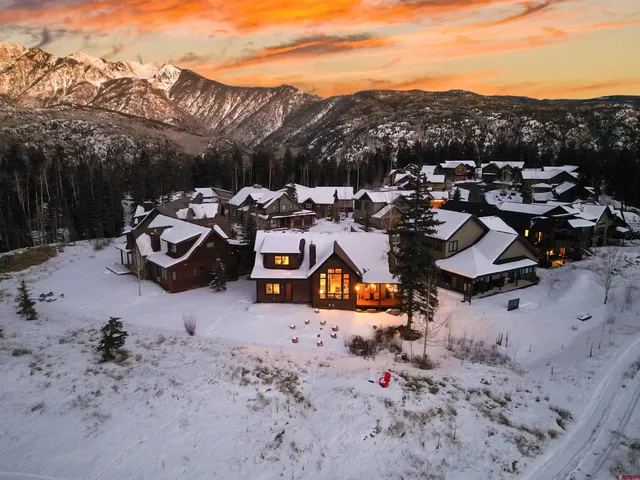 a view of a town with mountains in the background