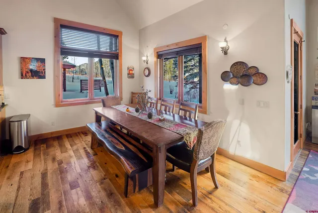 a dining room with furniture and window