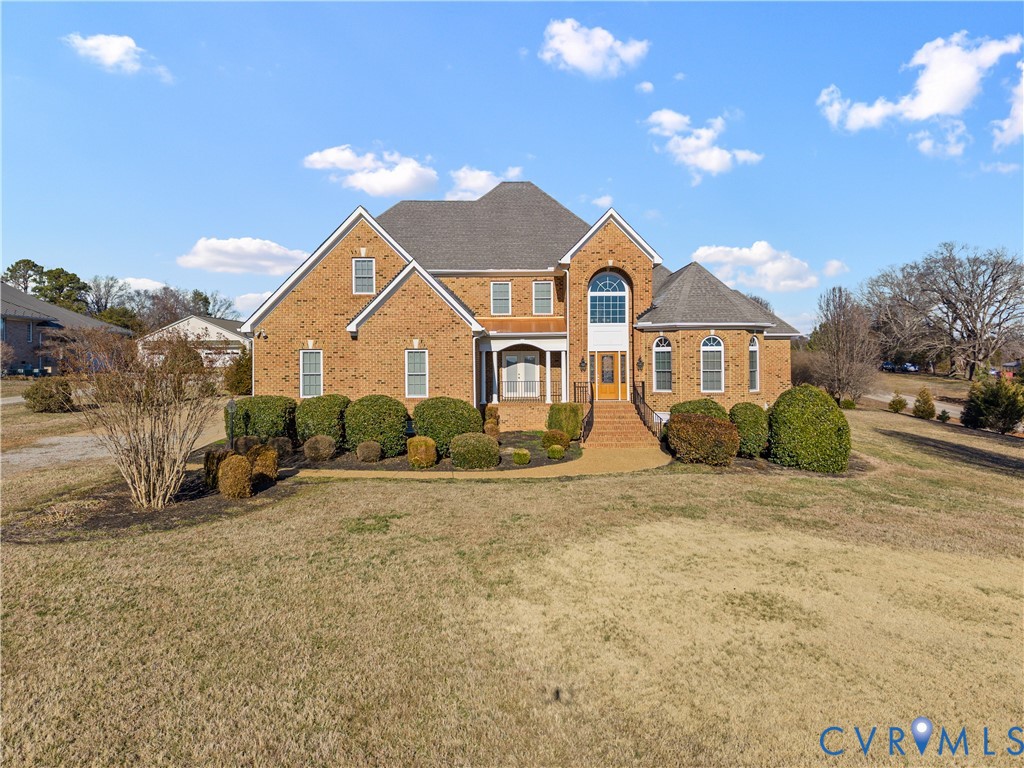 270 Petersburg Road Powhatan, VA 23139 - Photo 2 of 90 a view of a big house with a big yard and large trees