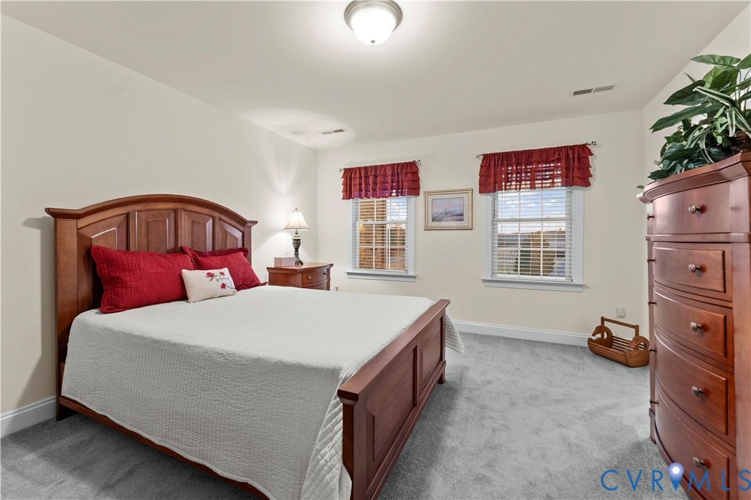 270 Petersburg Road Powhatan, VA 23139 - Photo 50 of 90 a bedroom with a bed and a dresser