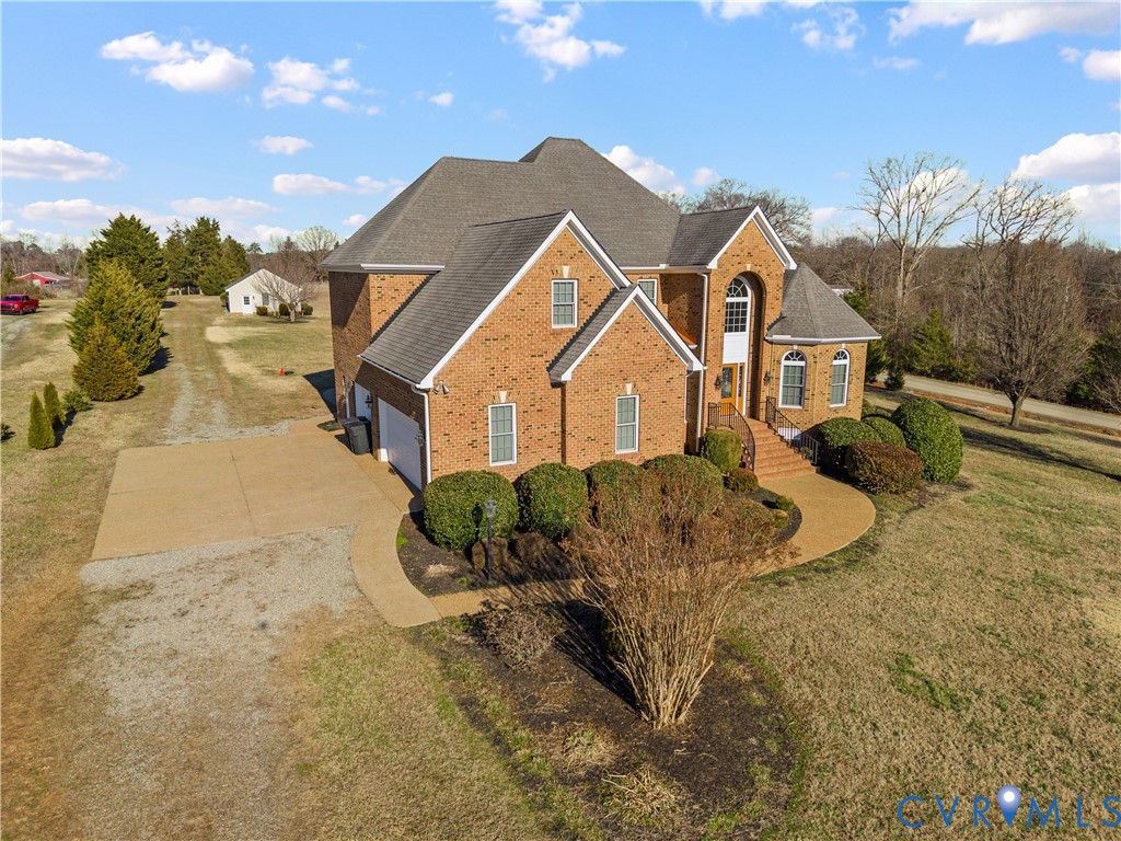 270 Petersburg Road Powhatan, VA 23139 - Photo 5 of 90 a front view of a house with a yard and garage