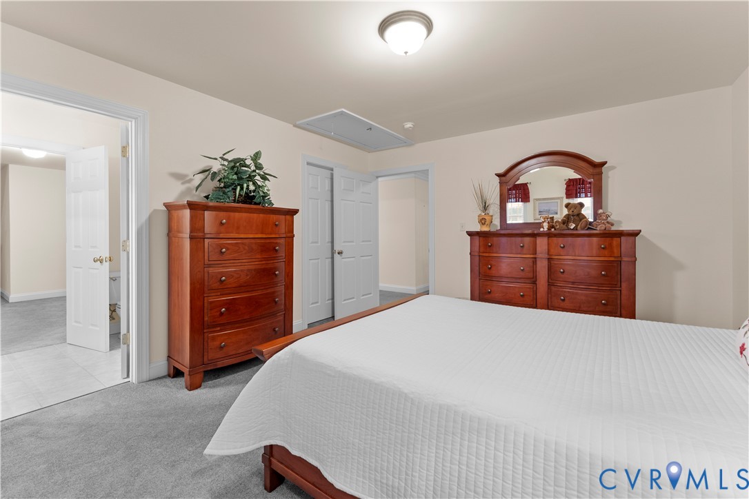 270 Petersburg Road Powhatan, VA 23139 - Photo 51 of 90 a bedroom with a bed and a dresser