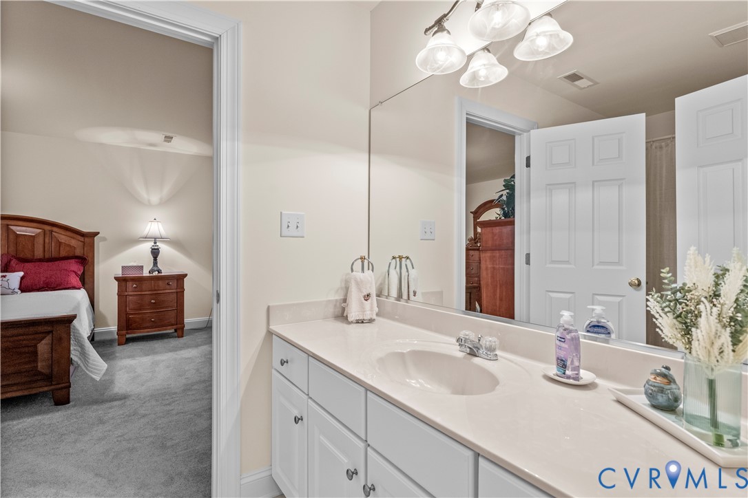 270 Petersburg Road Powhatan, VA 23139 - Photo 53 of 90 a bathroom with a sink double vanity and a mirror