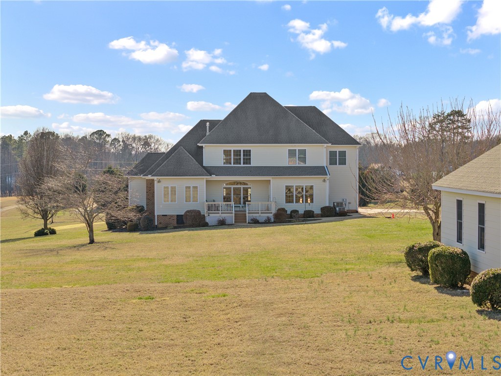 270 Petersburg Road Powhatan, VA 23139 - Photo 71 of 90 a front view of a house with a yard and swimming pool