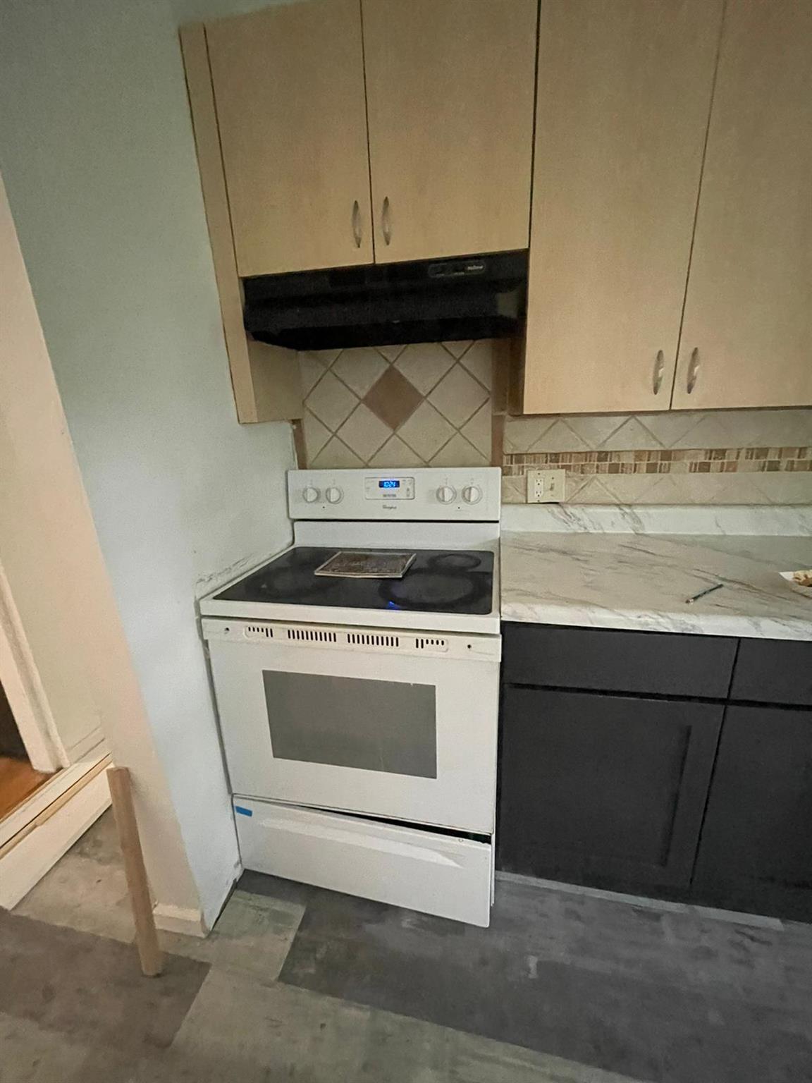 4710 State Rte 55 Bethel, NY 12783 - Photo 12 of 30 Kitchen with white electric range and backsplash
