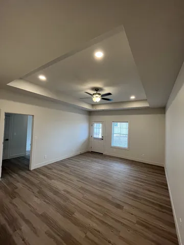 a view of a livingroom with wooden floor