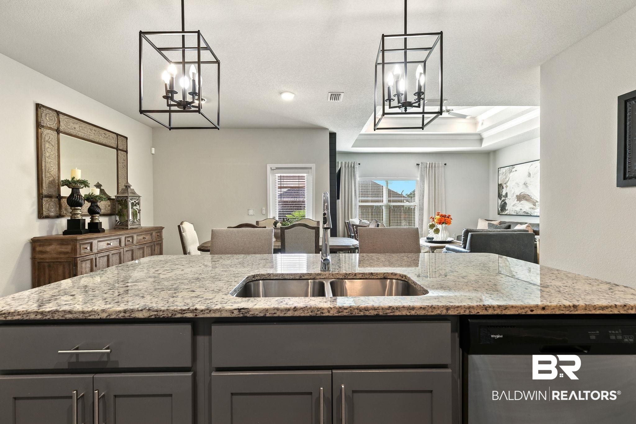31650 Memphis Loop Daphne, AL 36527 - Photo 68 of 68 Kitchen featuring hanging lights, dishwasher, open floor plan, light stone counters, and a raised ceiling