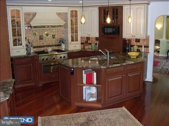 600 Crum Creek Road Media, PA 19063 - Photo 6 of 12 a kitchen with stainless steel appliances granite countertop a stove a sink and a microwave