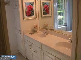600 Crum Creek Road Media, PA 19063 - Photo 7 of 12 a bathroom with a sink and a mirror