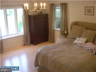 600 Crum Creek Road Media, PA 19063 - Photo 8 of 12 a bed sitting in a bedroom next to a window