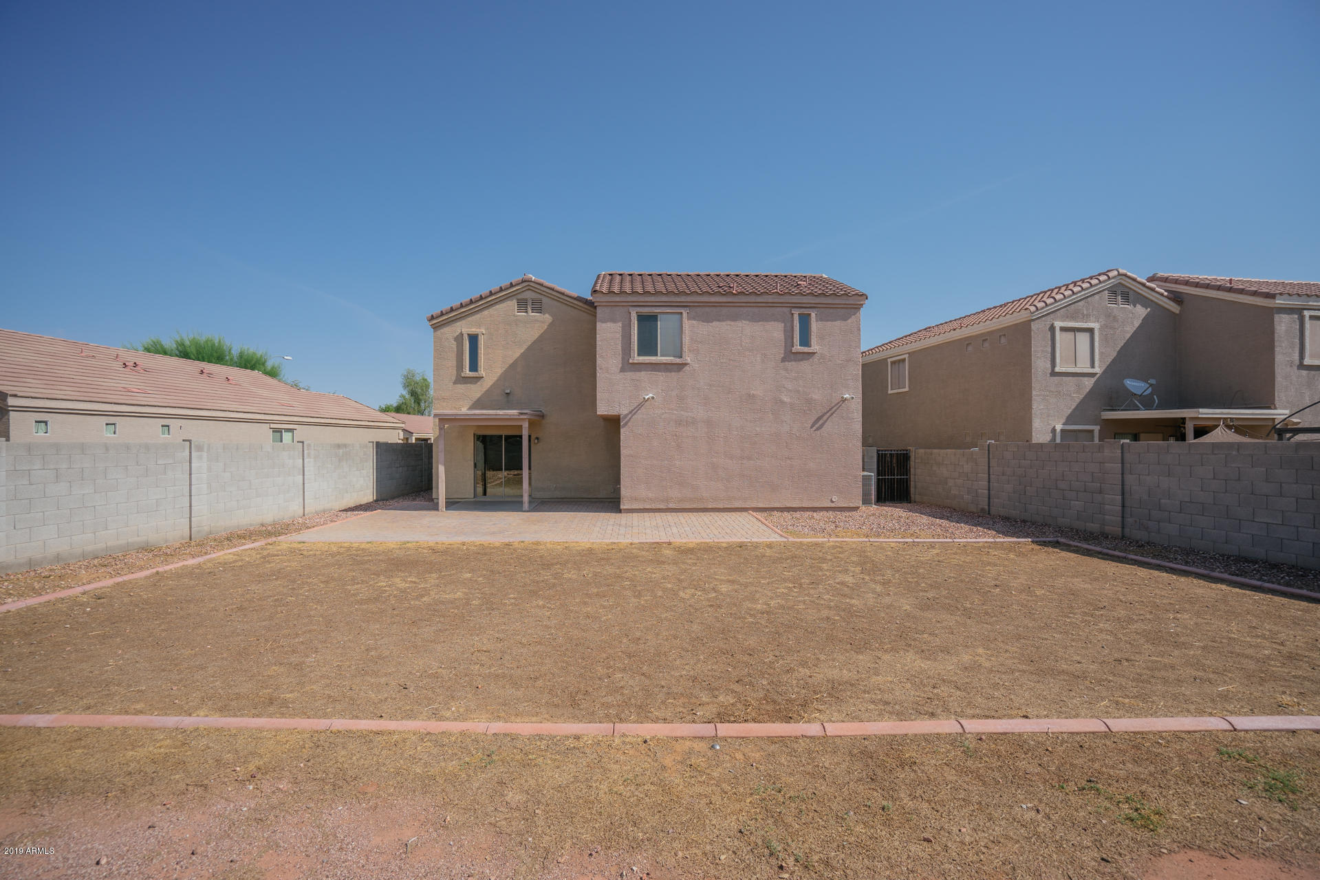 17551 West Calavar Road Surprise, AZ 85388 - Photo 5 of 21 a front view of a house with a yard