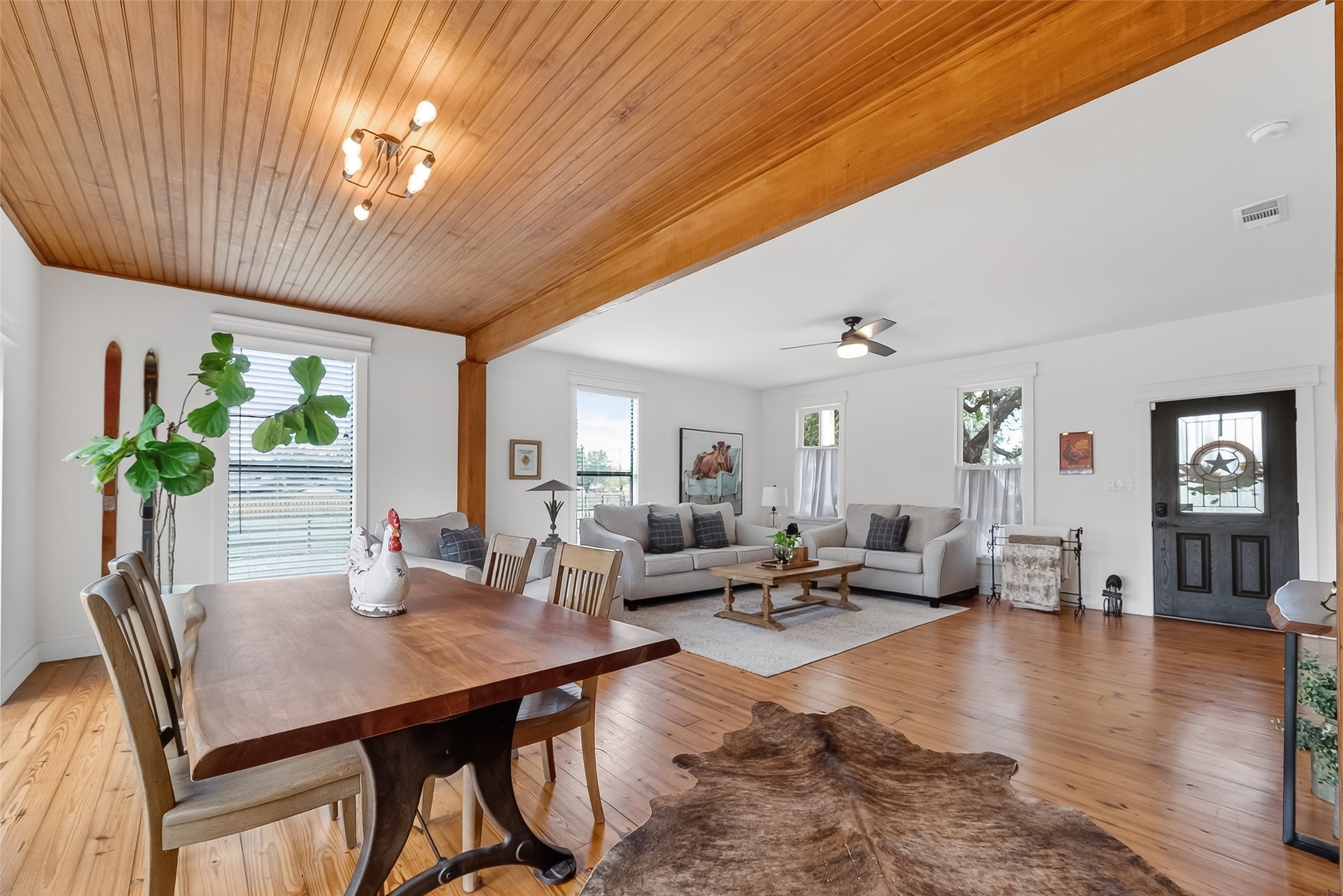 1808 Tabor Street Houston, TX 77009 - Photo 6 of 26 a living room with furniture a large window and wooden floor