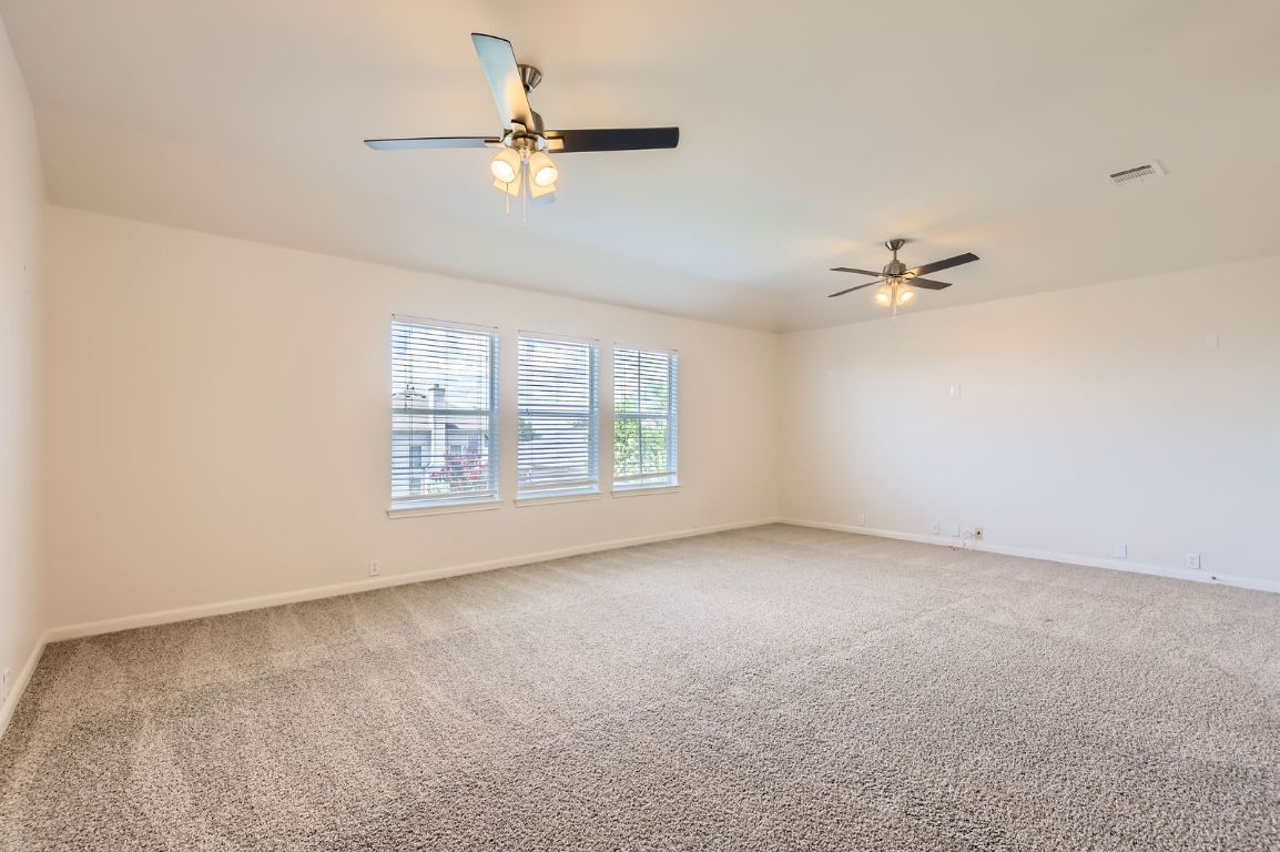 3423 Shiraz Loop Round Rock, TX 78665 - Photo 23 of 28 a view of an empty room with a window