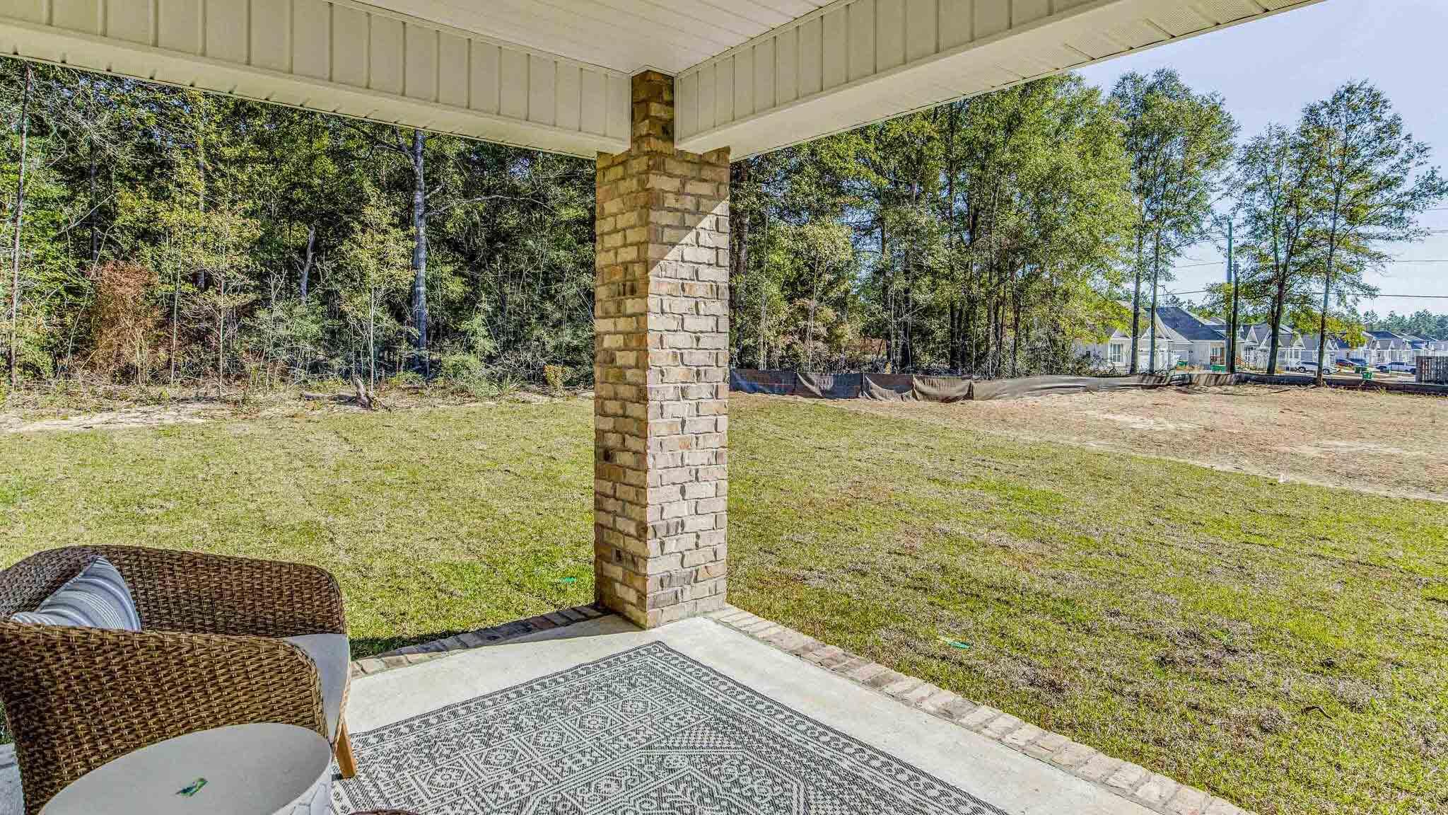 4418 Marine Loop Crestview, FL 32539 - Photo 30 of 35 a view of a balcony with chair and floor to ceiling window