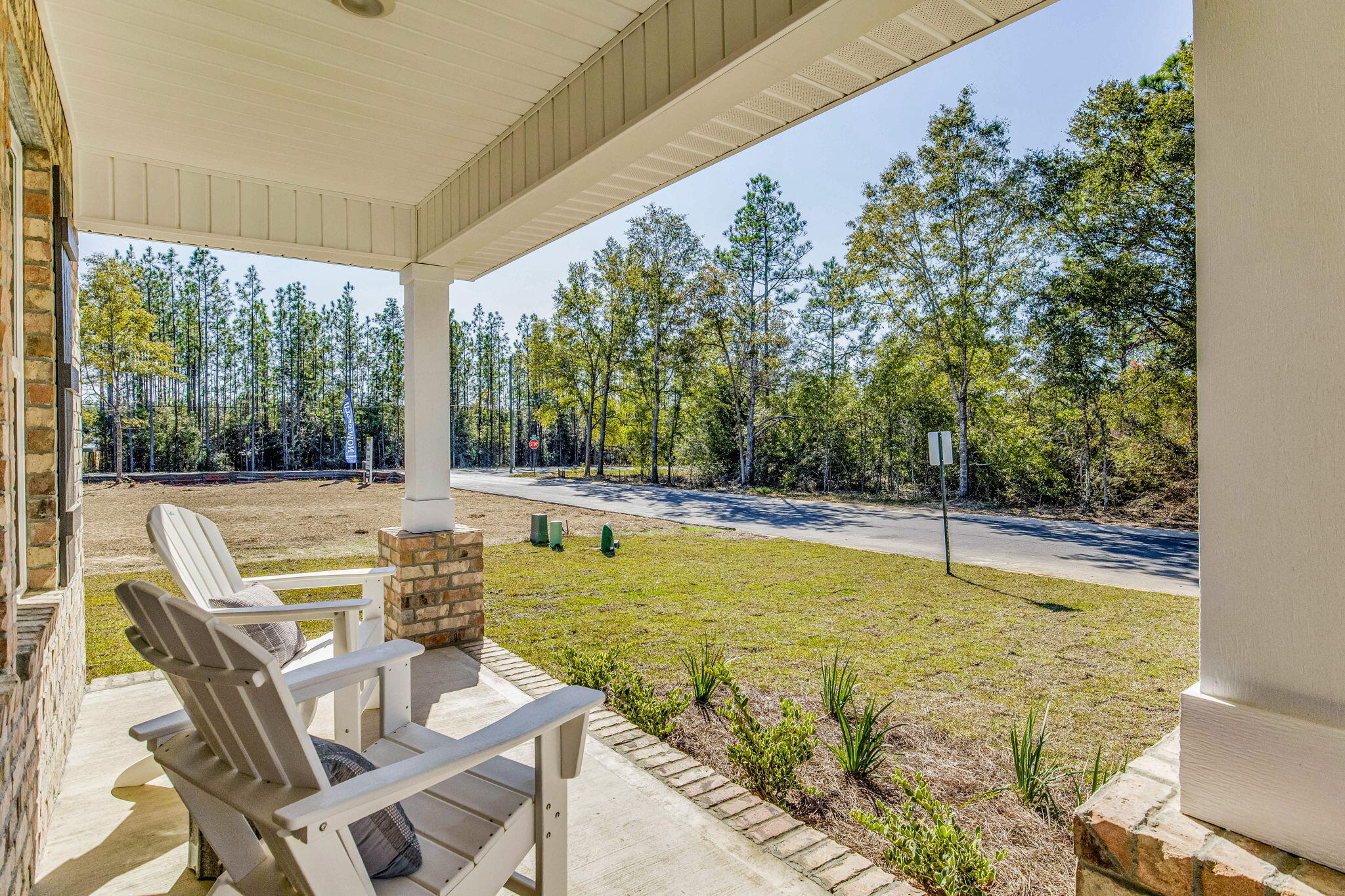 4418 Marine Loop Crestview, FL 32539 - Photo 31 of 35 a view of a swimming pool with chairs and table in the patio