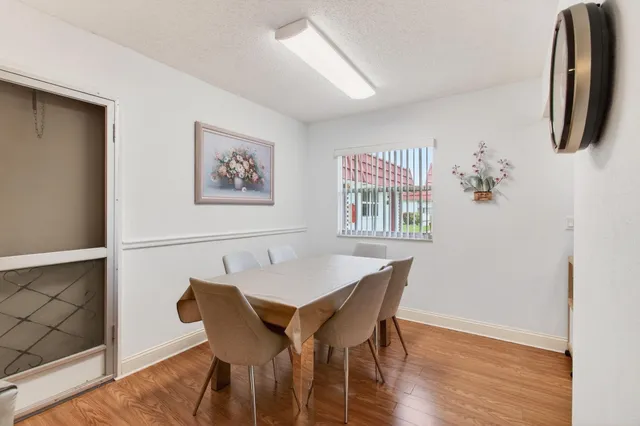 a kitchen with granite countertop a stove a sink and a microwave