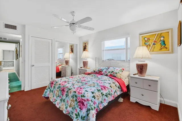 a utility room with wooden floor and lots of racks