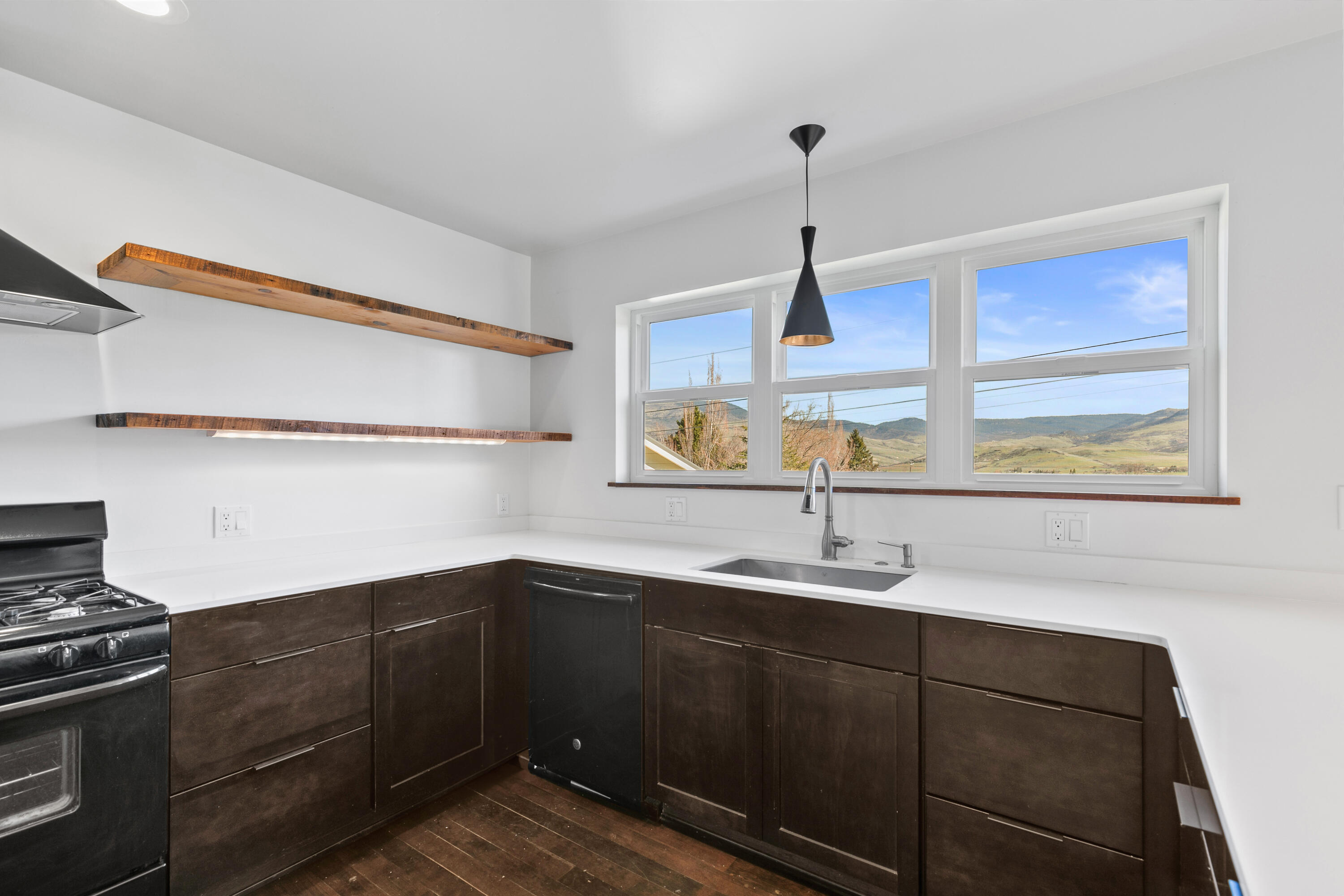 593 Crowson Road Ashland, OR 97520 - Photo 7 of 36 a kitchen with a sink and a refrigerator