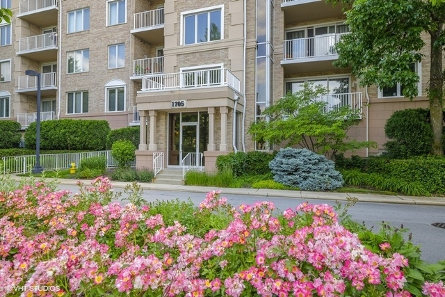 1705 Pavilion Way, Unit 504 Park Ridge, IL 60068 - Photo 1 of 15 a view of a house with a lot of flower plants