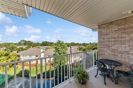 1705 Pavilion Way, Unit 504 Park Ridge, IL 60068 - Photo 2 of 15 a view of a balcony with furniture