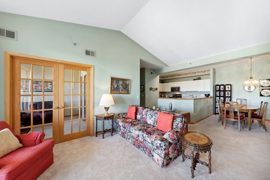 1705 Pavilion Way, Unit 504 Park Ridge, IL 60068 - Photo 6 of 15 a living room with furniture kitchen view and a large window