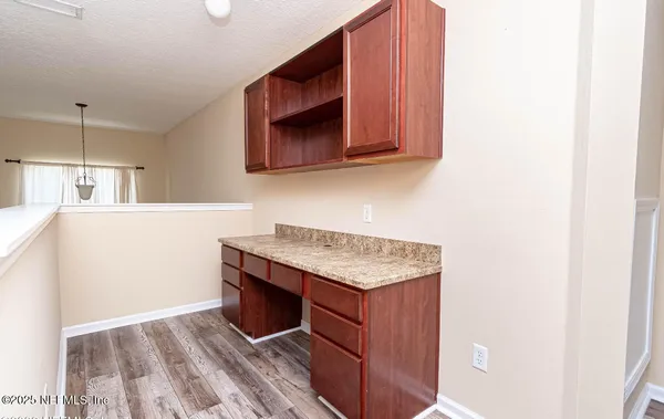a kitchen with stainless steel appliances granite countertop a sink and a microwave