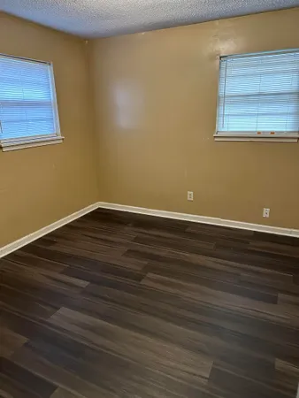 a view of a small space with wooden floor