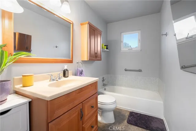 a bathroom with a sink toilet and bathtub
