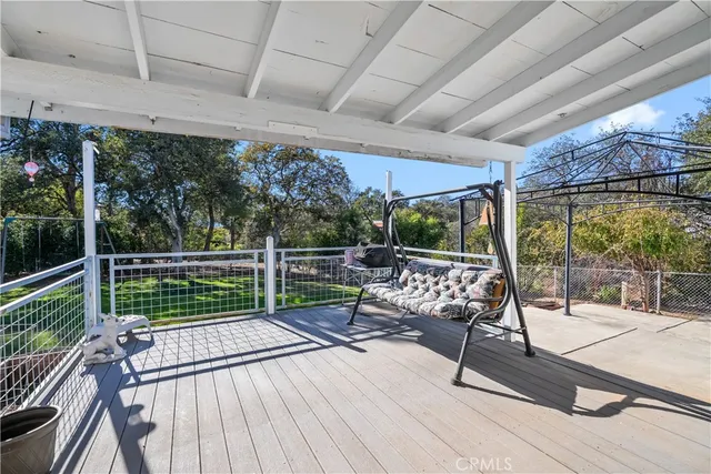 a view of a patio with a couple of chairs
