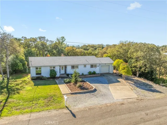 a view of a house with outdoor space and sitting area