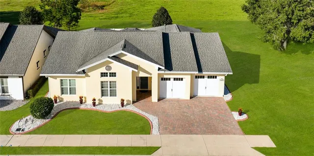 a living room with furniture a large window and a flat screen tv