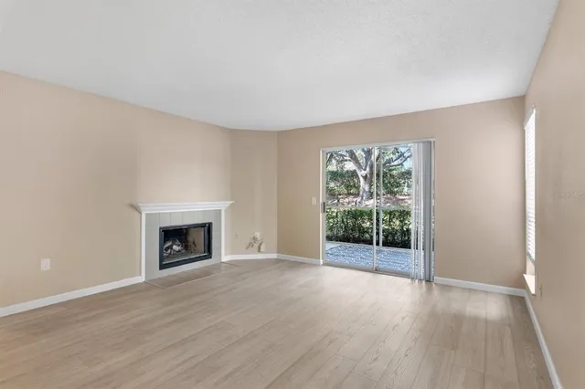 a bedroom with a large bed and a large window