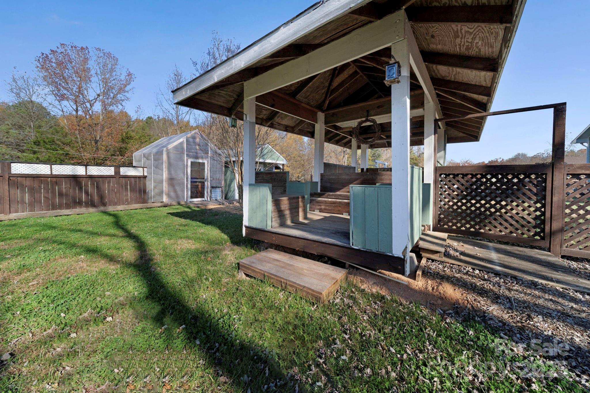3400 Griffith Road Monroe, NC 28112 - Photo 13 of 46 a view of a backyard with a small cabin