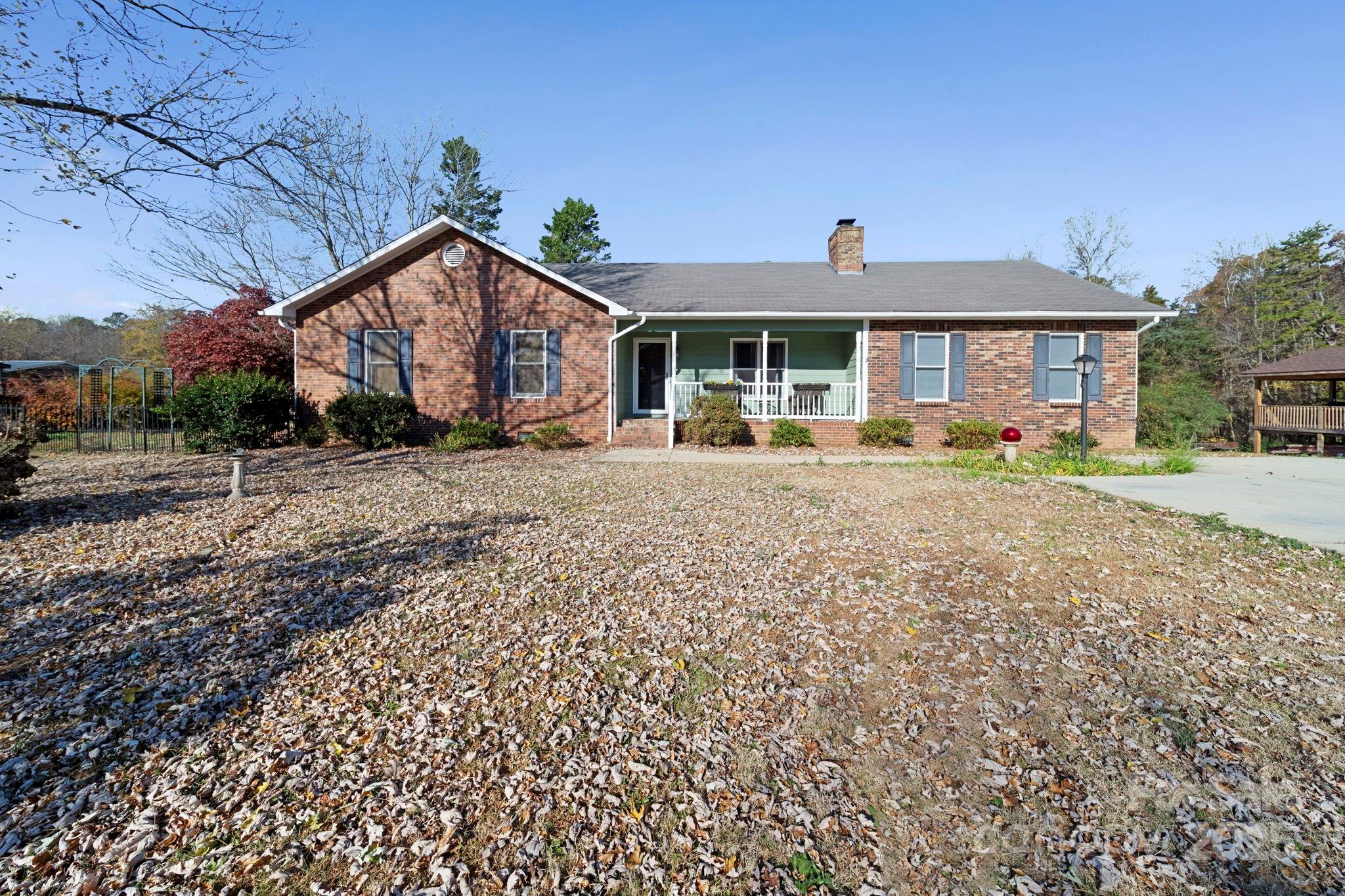 3400 Griffith Road Monroe, NC 28112 - Photo 2 of 46 a front view of a house with a yard