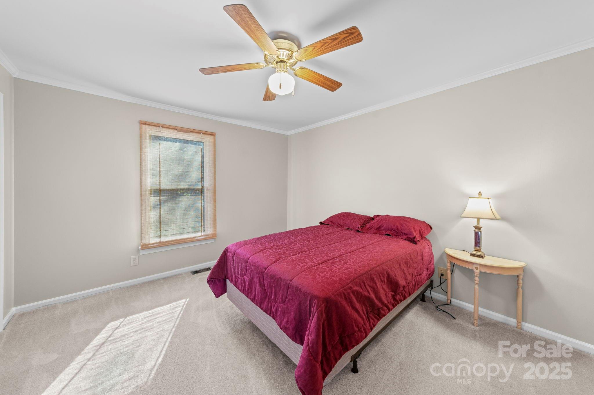 3400 Griffith Road Monroe, NC 28112 - Photo 23 of 46 a bedroom with a bed chandelier and a window