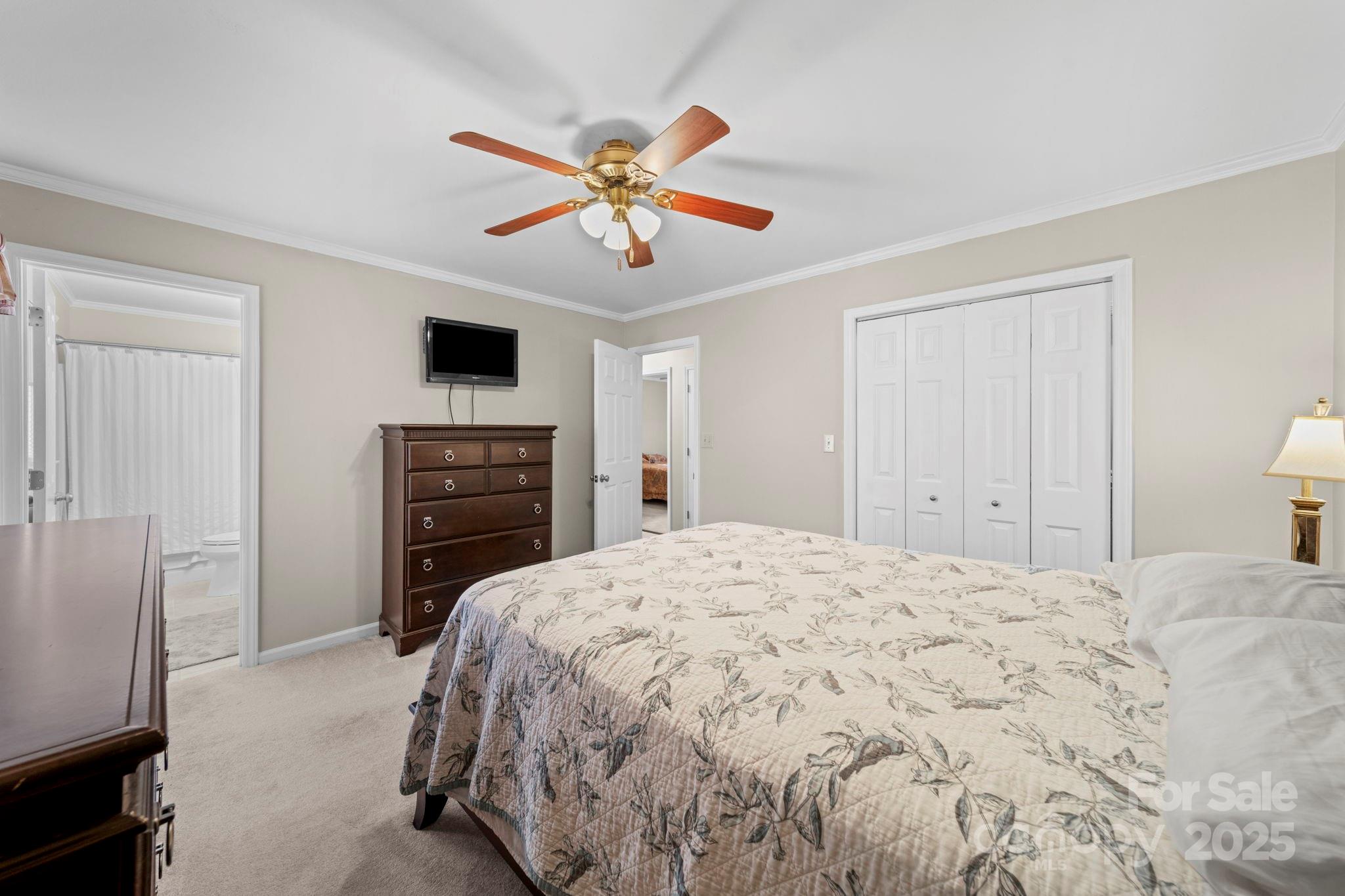3400 Griffith Road Monroe, NC 28112 - Photo 26 of 46 a bedroom with a bed and a flat screen tv