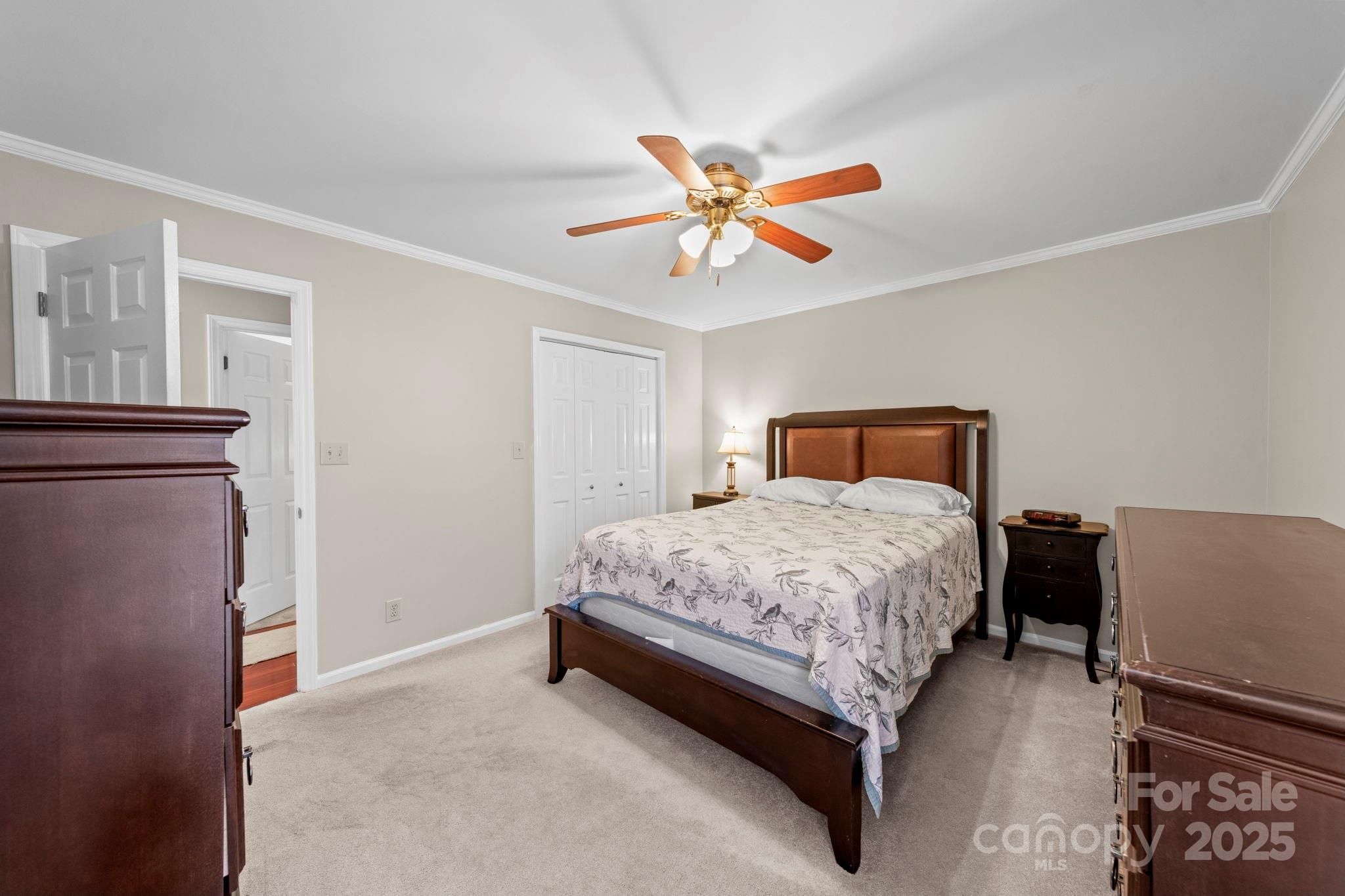 3400 Griffith Road Monroe, NC 28112 - Photo 27 of 46 a bedroom with a bed and a chandelier