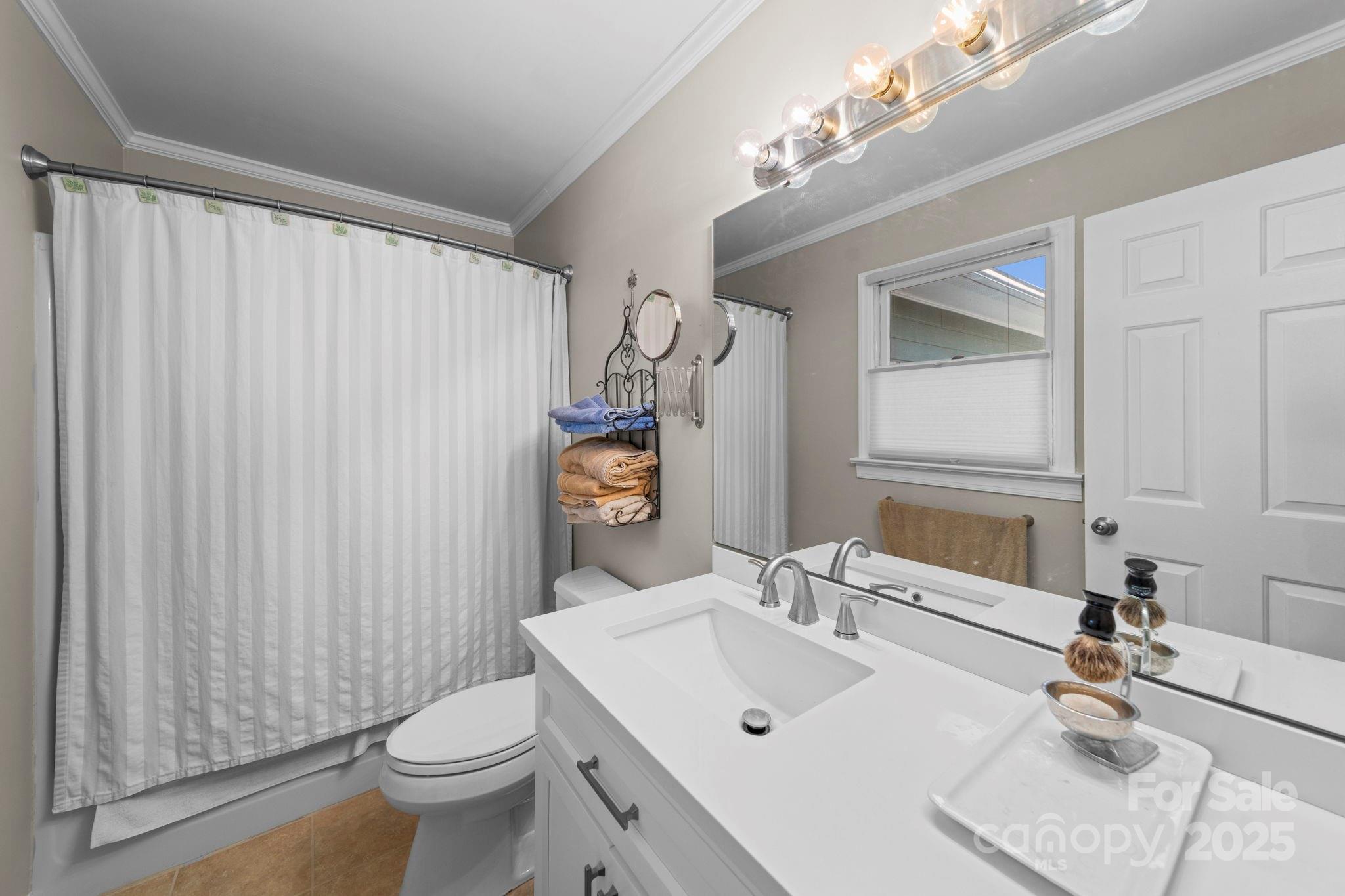 3400 Griffith Road Monroe, NC 28112 - Photo 28 of 46 a bathroom with a sink a toilet and a mirror