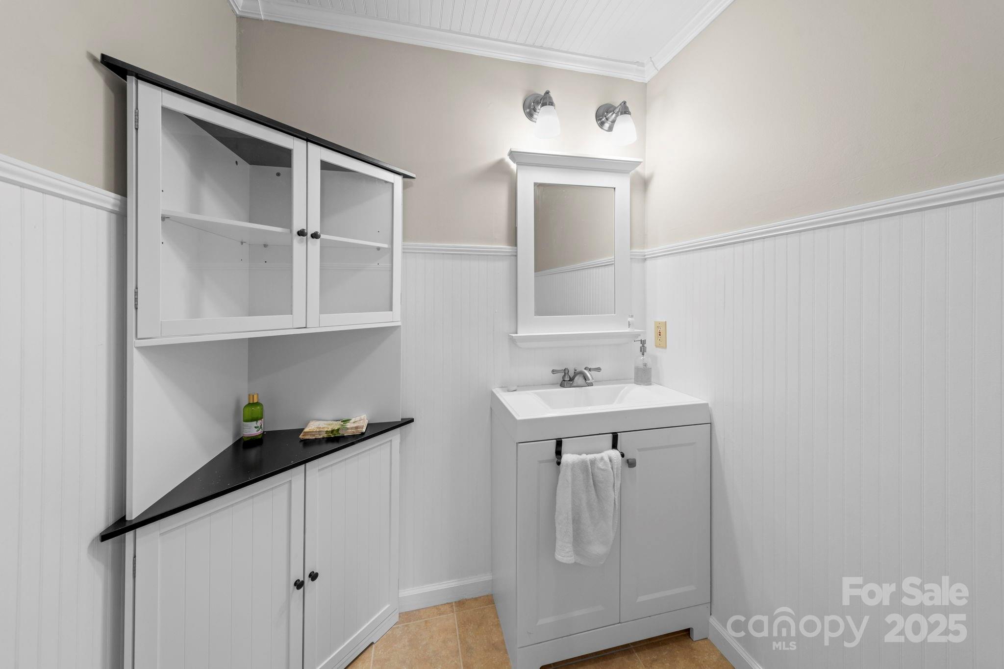 3400 Griffith Road Monroe, NC 28112 - Photo 31 of 46 a bathroom with a sink a toilet and vanity