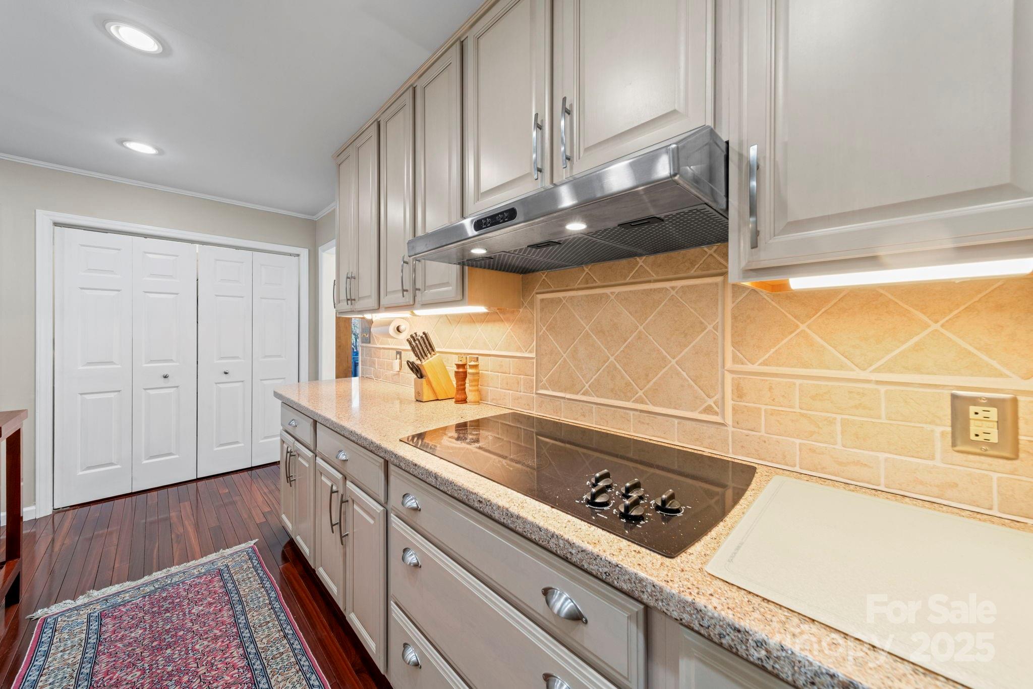 3400 Griffith Road Monroe, NC 28112 - Photo 33 of 46 a kitchen with a sink a stove and cabinets
