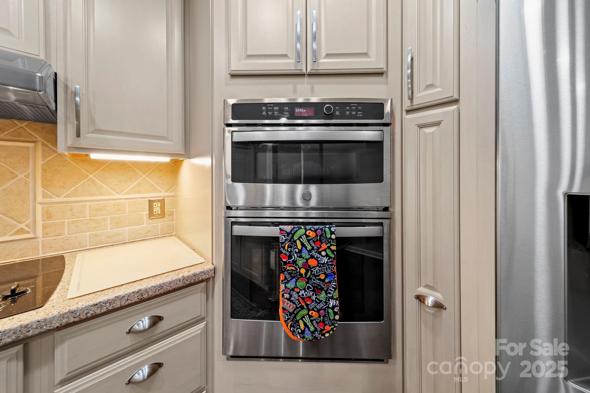 3400 Griffith Road Monroe, NC 28112 - Photo 34 of 46 a kitchen with granite countertop a oven and a stove