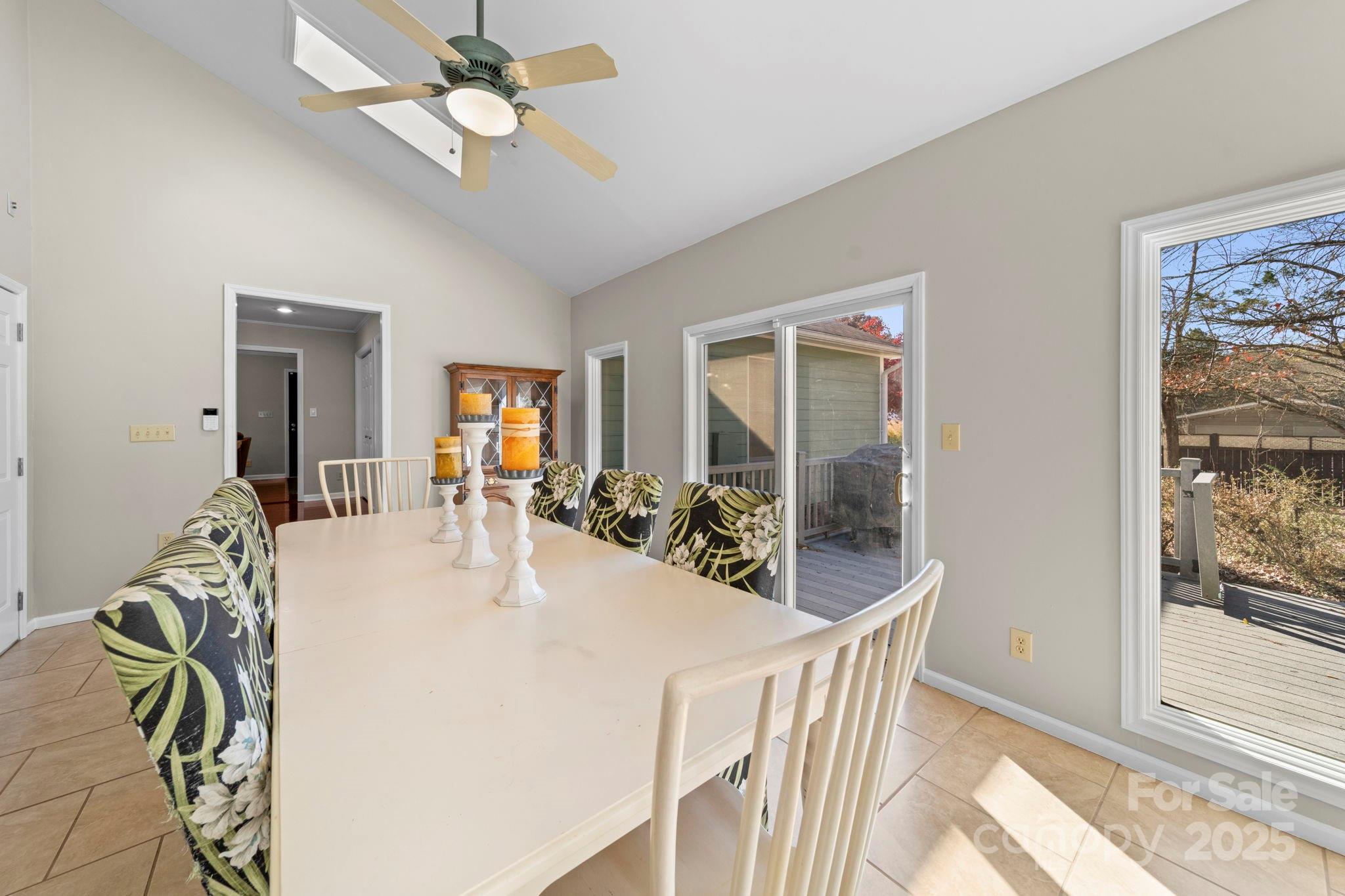 3400 Griffith Road Monroe, NC 28112 - Photo 41 of 46 a view of a dining room with furniture and a chandelier fan