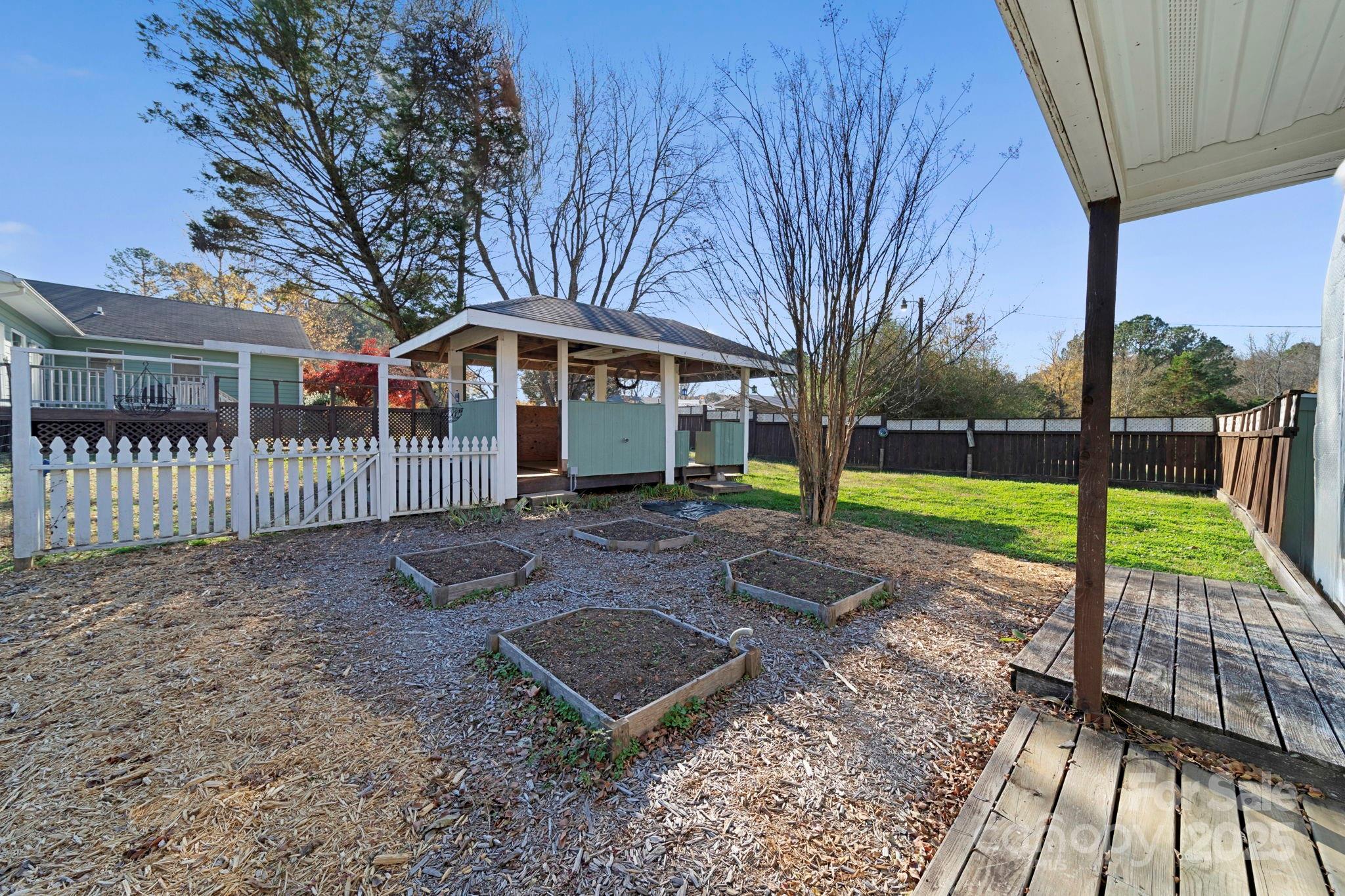 3400 Griffith Road Monroe, NC 28112 - Photo 10 of 46 a view of a house with backyard and a tree