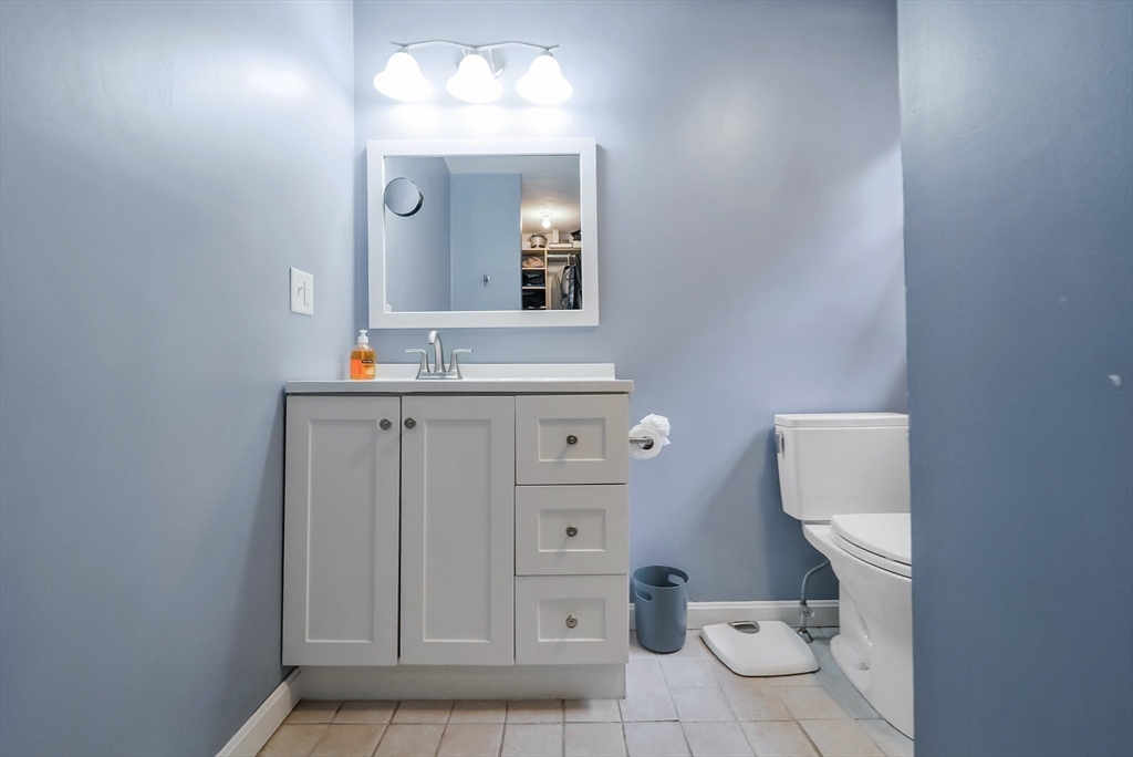 13 Taft Drive Franklin, MA 02038 - Photo 8 of 35 a bathroom with a toilet sink and mirror