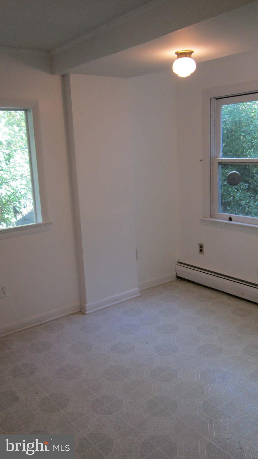 4525 Wilmslow Road Baltimore, MD 21210 - Photo 7 of 14 an empty room with a window