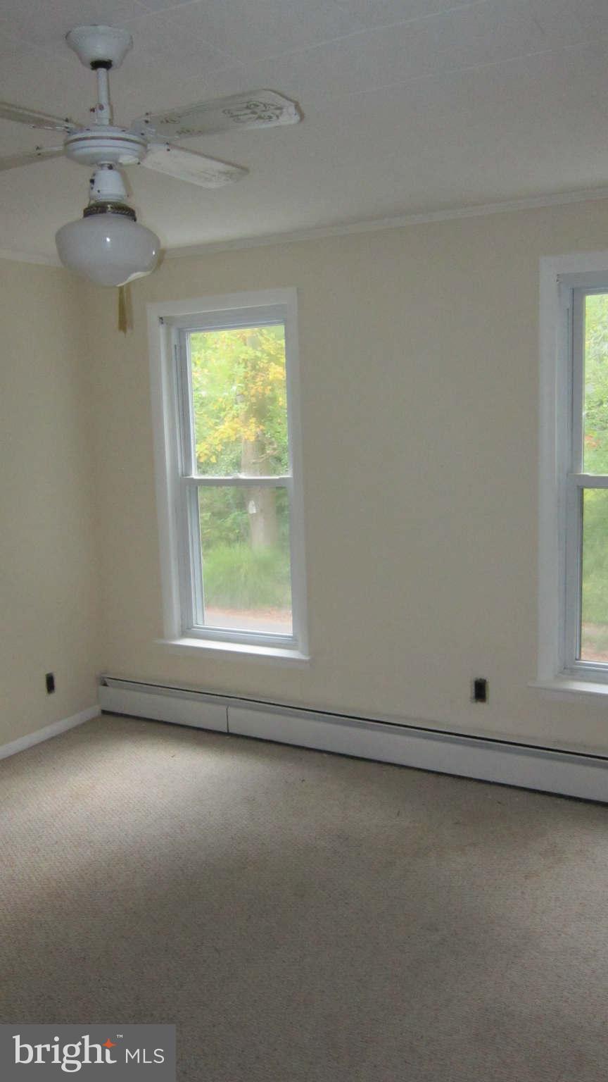 4525 Wilmslow Road Baltimore, MD 21210 - Photo 9 of 14 an empty room with a window