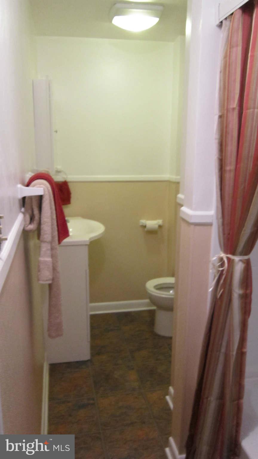 4525 Wilmslow Road Baltimore, MD 21210 - Photo 10 of 14 a bathroom with a sink and toilet